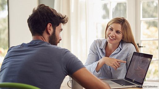 couple, at home, laptop, computer, online, working from home, connected, the internet, tech, shopping, buying, choosing, holiday, finance, personal finance, checking, investments, savings, pension, retirement, man, men, male, woman, women, female, two people, people, person, together, caucasian, 20s, twenties, 30s, thirties, horizontal, front view, waist up, happy, smiling, laughing, sitting, table